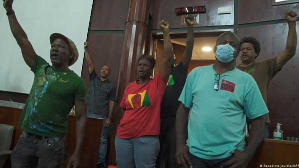 Protesters storm Guadeloupe legislature over vaccine mandate Protesters storm Guadeloupe legislature over vaccine mandate