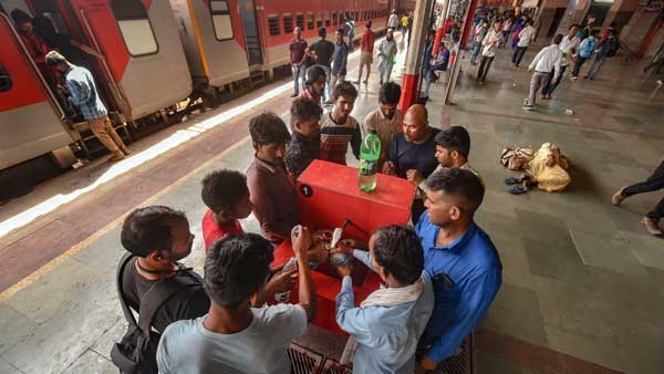 Passengers fill their water bottles from a public tap on a hot summer afternoon, at Charbagh railway station in Lucknow Passengers fill their water bottles from a public tap on a hot summer afternoon, at Charbagh railway station in Lucknow