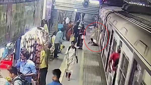 Watch: Woman saved by alert guard after she falls off moving train in Mumbai Watch: Woman saved by alert guard after she falls off moving train in Mumbai