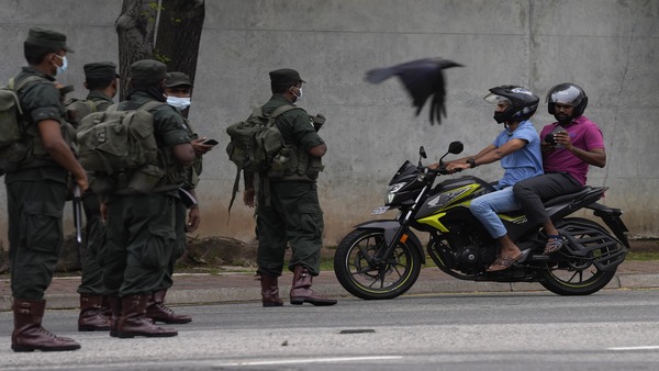 Sri Lankan army soldiers man a checkpoint during curfew imposed a day after clashes between government supporters and anti government protesters in Colombo. PTI Sri Lankan army soldiers man a checkpoint during curfew imposed a day after clashes between government supporters and anti government protesters in Colombo. PTI