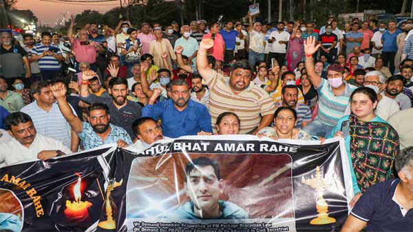 Kashmiri Pandits raise slogans during a protest against the Pakistan over the killing of Rahul Bhat, in Jammu Kashmiri Pandits raise slogans during a protest against the Pakistan over the killing of Rahul Bhat, in Jammu