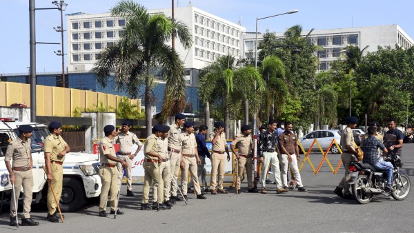 Police personnel stand guard as Maharashtras MPs and MLAs conduct a meeting, outside Le Meridien hotel in Surat, Tuesday Police personnel stand guard as Maharashtras MPs and MLAs conduct a meeting, outside Le Meridien hotel in Surat, Tuesday