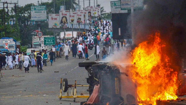 Flames and smoke rise from a vehicle on fire, that was allegedly set ablaze by miscreants during a protest over controversial remarks made by two now-suspended BJP leaders about Prophet Mohammad Flames and smoke rise from a vehicle on fire, that was allegedly set ablaze by miscreants during a protest over controversial remarks made by two now-suspended BJP leaders about Prophet Mohammad