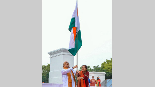 Union Home Minister Amit Shah along with his wife Sonal Shah hoists the national flag at his residence for the Har Ghar Tiranga campaign, in New Delhi. Union Home Minister Amit Shah along with his wife Sonal Shah hoists the national flag at his residence for the Har Ghar Tiranga campaign, in New Delhi.