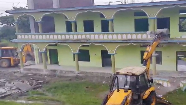 Assam: Madrassa with links to terror outfits demolished for building norms violation Assam: Madrassa with links to terror outfits demolished for building norms violation