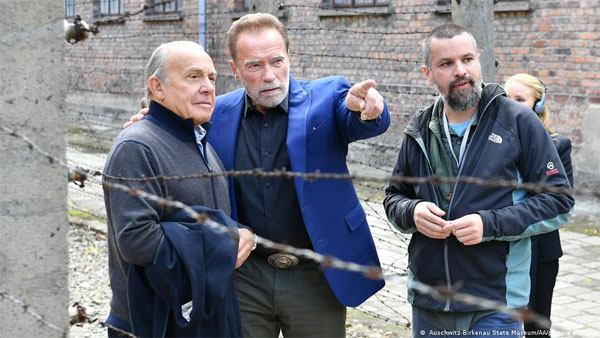 Schwarzenegger visits Auschwitz to fight hate Schwarzenegger visits Auschwitz to fight hate