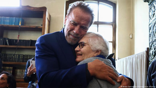 Schwarzenegger visits Auschwitz to fight hate Schwarzenegger visits Auschwitz to fight hate