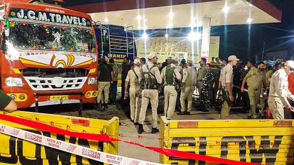 Police inspect the site after bomb explosion at a bus stand in Udhampur Police inspect the site after bomb explosion at a bus stand in Udhampur