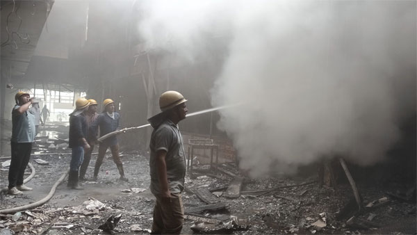 Firefighters try to douse a fire that broke out at a mall in Gurugram Firefighters try to douse a fire that broke out at a mall in Gurugram