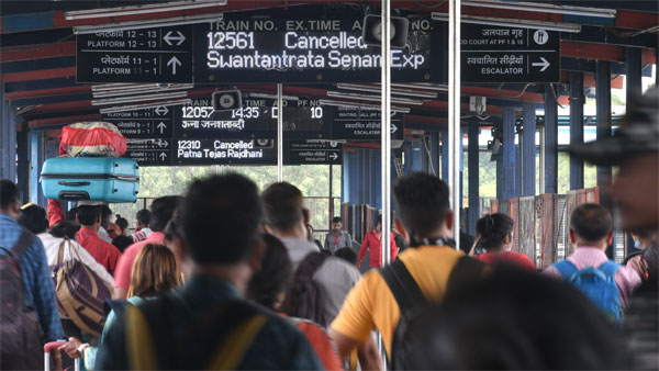 Commuters at New Delhi railway station after several trains got cancelled Commuters at New Delhi railway station after several trains got cancelled