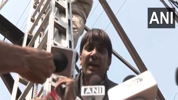 Denied ticket, former AAP councillor climbs transmission tower | Video Denied ticket, former AAP councillor climbs transmission tower | Video