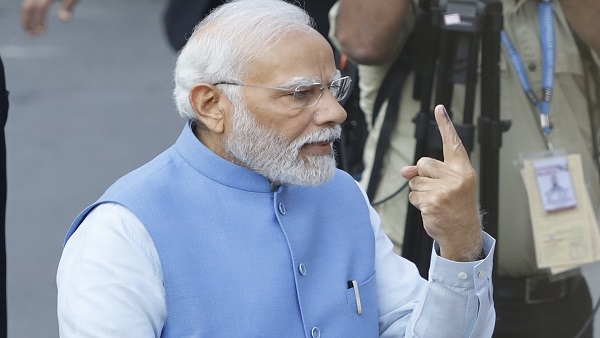 PM Modi stands in queue, casts his vote in Ahmedabad PM Modi stands in queue, casts his vote in Ahmedabad