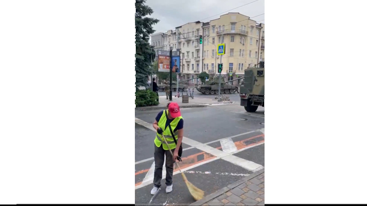 Russia Coup: Man Continues To Clean Street as Armed Convoy Arrives in Rostov